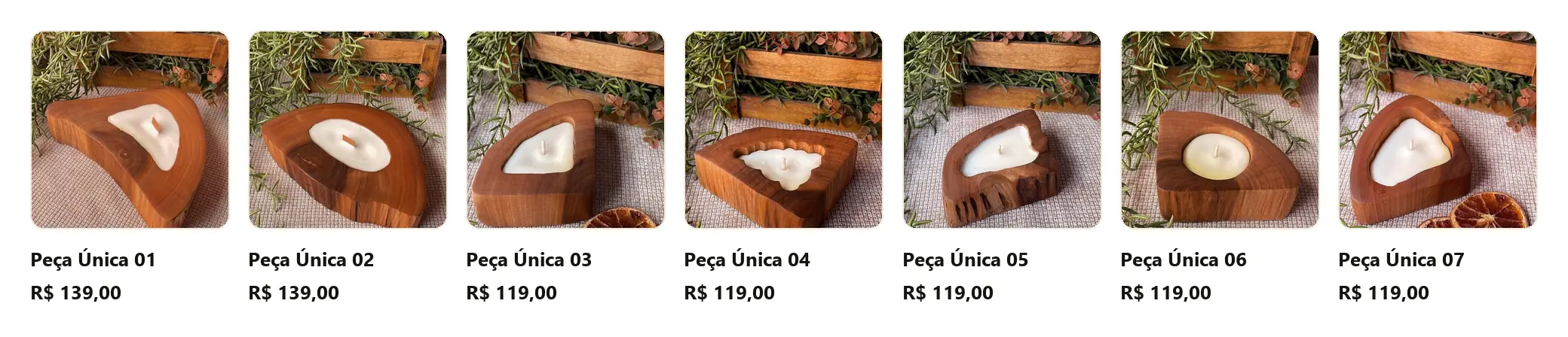 As sete velas da categoria Esculpidas da Mad'Lume, da Peça Única 01 à 07, cada uma com um formato de tronco diferente, nome próprio e preço de R$ 119,00 a R$ 139,00